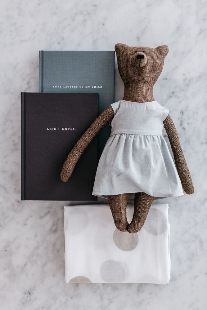 Photo of our Motherhood Kindness Kit featuring Life + Notes journal, Love Letters to My Child, muslin wrap and Grace bear. A beautiful baby gift set.